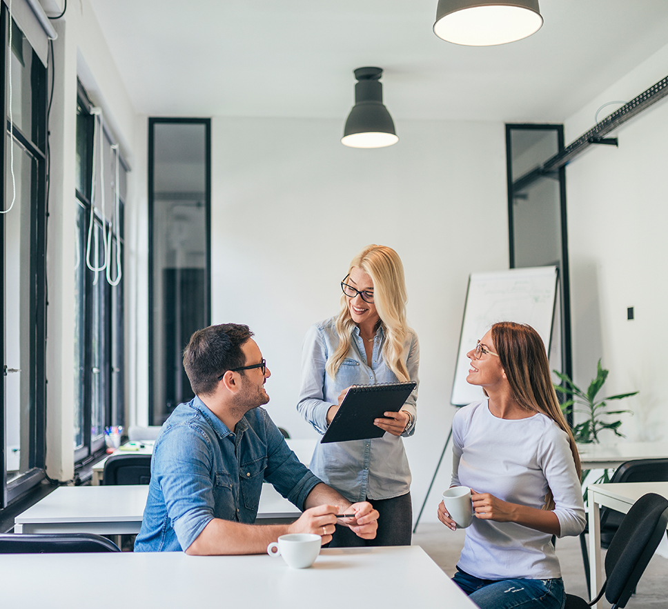 a team of 3 people having a meeting